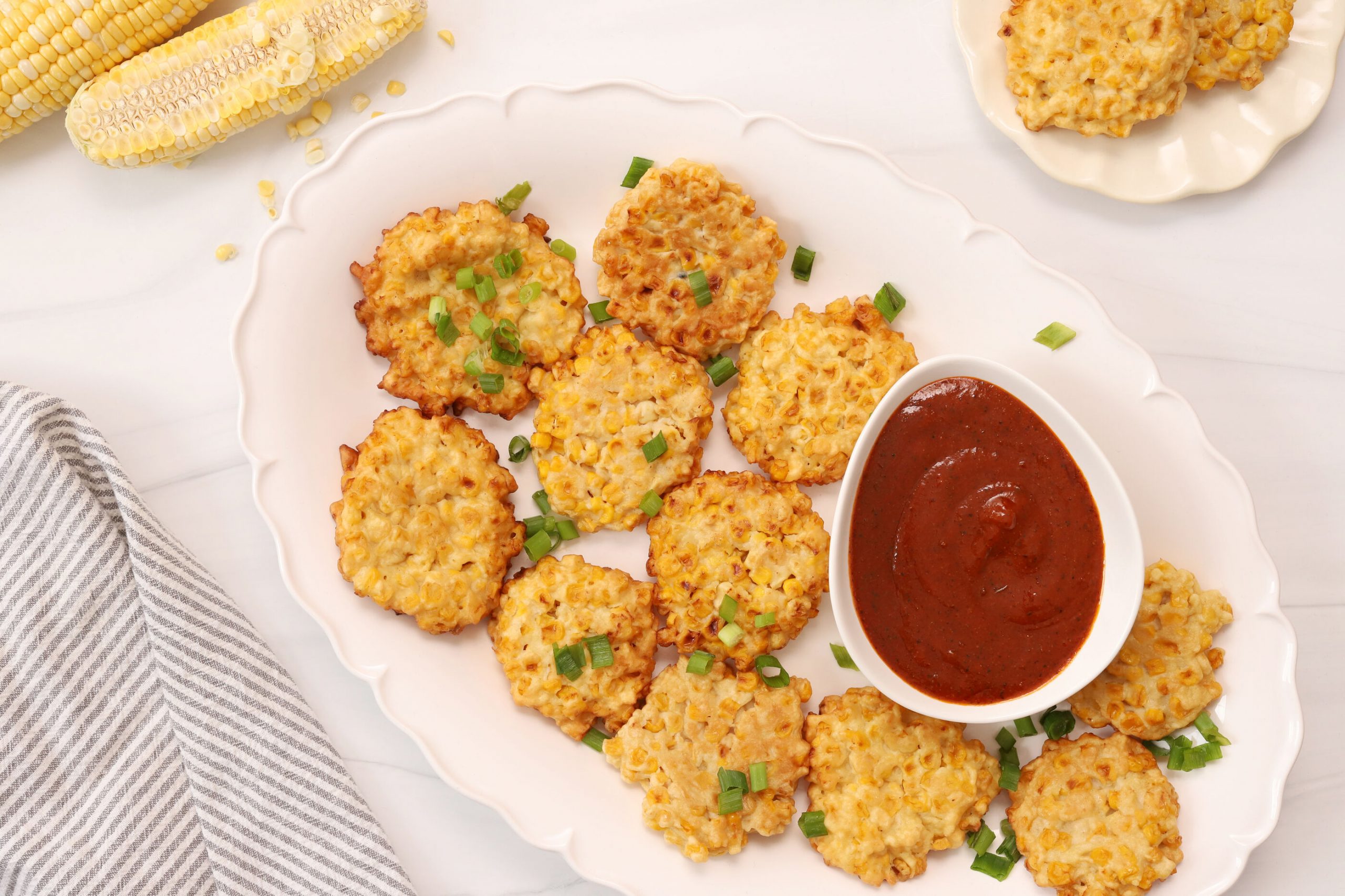 Corn Fritters with Smothered Cajun Dipping Sauce - Schlotterbeck & Foss